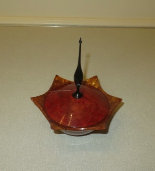 This lidded dish with finial won a turning of the month certificate for Howard Overton